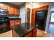 Functional kitchen with island, granite countertops, and stainless appliances at 122 Summer Pl, Norcross, GA 30071