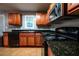 Well-equipped kitchen featuring stainless steel appliances and wood cabinets at 122 Summer Pl, Norcross, GA 30071