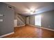 Spacious living room with tile floors, stairs, and a large window, offering a bright and inviting atmosphere at 122 Summer Pl, Norcross, GA 30071