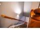 Staircase with wood railing and carpeted steps leading to a white door at 122 Summer Pl, Norcross, GA 30071