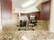 A full kitchen with granite countertops, stainless steel appliances, and stacked washer and dryer at 200 Renaissance Ne Pkwy # 310, Atlanta, GA 30308