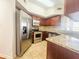 Well-equipped kitchen featuring stainless steel appliances, granite countertops, and warm wood cabinetry at 200 Renaissance Ne Pkwy # 310, Atlanta, GA 30308