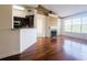 Bright living room boasts a fireplace, vaulted ceiling, hardwood floors, and a view of trees at 200 Renaissance Ne Pkwy # 310, Atlanta, GA 30308
