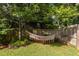 Lush backyard featuring a hammock, providing a serene space for relaxation and enjoying nature at 2092 Wood Nw Trl, Atlanta, GA 30318
