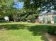 Spacious backyard with lush green lawn, perfect for outdoor activities and relaxation with playground at 2092 Wood Nw Trl, Atlanta, GA 30318