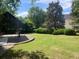 A tranquil backyard with a covered seating area, ideal for outdoor gatherings at 2092 Wood Nw Trl, Atlanta, GA 30318