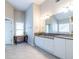 Bathroom featuring white cabinetry, granite counters, and dual sinks at 2092 Wood Nw Trl, Atlanta, GA 30318