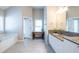 Bathroom with glass shower, soaking tub, and granite vanity at 2092 Wood Nw Trl, Atlanta, GA 30318