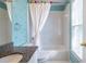 bath with rainbow wallpaper, tub shower, and granite top vanity at 2092 Wood Nw Trl, Atlanta, GA 30318