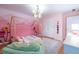 Playful bedroom features a whimsical mural, unique canopy bed frame, and decorative chandelier at 2092 Wood Nw Trl, Atlanta, GA 30318