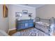 Bedroom featuring wooden floors, blue bureau, and iron crib at 2092 Wood Nw Trl, Atlanta, GA 30318