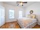 Bedroom with hardwood floors, ceiling fan, and bright windows at 2092 Wood Nw Trl, Atlanta, GA 30318