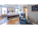 Comfortable bedroom with tray ceiling, natural light, and a cozy recliner at 2092 Wood Nw Trl, Atlanta, GA 30318