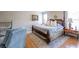 Elegant bedroom with a four-poster bed, soft lighting, and patterned rug at 2092 Wood Nw Trl, Atlanta, GA 30318