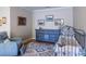 Nicely decorated bedroom with blue bureau, patterned rug, and iron baby crib at 2092 Wood Nw Trl, Atlanta, GA 30318