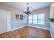The dining room features a modern chandelier and large sun-filled windows at 2092 Wood Nw Trl, Atlanta, GA 30318