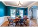 Bright dining room with blue walls, wainscoting and hardwood floors at 2092 Wood Nw Trl, Atlanta, GA 30318