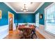 Charming dining room with blue walls and a chandelier at 2092 Wood Nw Trl, Atlanta, GA 30318