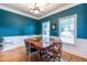 Traditional dining room boasts hardwood floors, crown molding and soothing blue walls at 2092 Wood Nw Trl, Atlanta, GA 30318