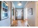 Bright entryway with hardwood floors, blue ceiling, and picture frame windows showcasing a warm welcome at 2092 Wood Nw Trl, Atlanta, GA 30318