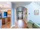 Hallway view shows wood floors, access to the kitchen, and an arched entryway at 2092 Wood Nw Trl, Atlanta, GA 30318