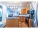 Modern kitchen with stainless steel appliances, stylish lighting, and seamless access to other living spaces at 2092 Wood Nw Trl, Atlanta, GA 30318