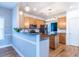 Stylish kitchen featuring stainless steel appliances, wood cabinets, and a granite island at 2092 Wood Nw Trl, Atlanta, GA 30318