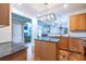 Well-lit kitchen featuring granite countertops, stainless appliances, and stylish light fixtures at 2092 Wood Nw Trl, Atlanta, GA 30318