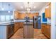 Well-lit kitchen features stainless appliances, an island, and granite countertops at 2092 Wood Nw Trl, Atlanta, GA 30318