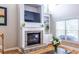 Brick fireplace with built-in shelving in a bright living room at 2092 Wood Nw Trl, Atlanta, GA 30318