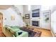 Bright living room featuring a fireplace, built-in shelves, and hardwood floors at 2092 Wood Nw Trl, Atlanta, GA 30318