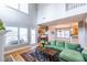 Sun-filled living room with a fireplace and open access to the kitchen and dining area at 2092 Wood Nw Trl, Atlanta, GA 30318