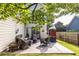 Outdoor patio area with comfortable seating, ideal for relaxing and entertaining in the backyard at 2092 Wood Nw Trl, Atlanta, GA 30318