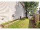 Side yard features lush grass, providing a picturesque view and tranquil atmosphere at 2092 Wood Nw Trl, Atlanta, GA 30318