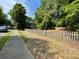 A quaint yard with a traditional picket fence for added charm and privacy at 2092 Wood Nw Trl, Atlanta, GA 30318