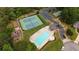 Aerial view of community amenities including a swimming pool, tennis courts, and playground areas at 285 Finsbury Park Ct, Suwanee, GA 30024