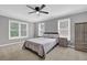 Serene bedroom with a neutral color palette, ample natural light, and simple decor at 285 Finsbury Park Ct, Suwanee, GA 30024