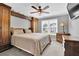 Cozy bedroom with natural wood accents, a window, and neutral decor at 285 Finsbury Park Ct, Suwanee, GA 30024