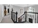 Elegant foyer featuring iron stair railings, soaring ceilings, and natural light at 285 Finsbury Park Ct, Suwanee, GA 30024