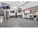 Organized garage with ample storage cabinets, work area, and epoxy flooring at 285 Finsbury Park Ct, Suwanee, GA 30024