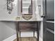Stylish powder room features a vessel sink, decorative mirror, and modern fixtures at 285 Finsbury Park Ct, Suwanee, GA 30024