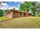 A spacious backyard featuring a well-maintained lawn and a classic brick home at 2931 Randolph Ct, Conyers, GA 30012
