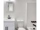 Bright bathroom with a modern vanity, toilet, and tub with shower at 2931 Randolph Ct, Conyers, GA 30012