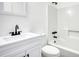 Bathroom featuring a white vanity, toilet, and tub with black fixtures at 2931 Randolph Ct, Conyers, GA 30012