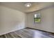 Bright bedroom featuring sleek flooring, a window view, and ample natural light at 2931 Randolph Ct, Conyers, GA 30012