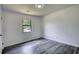 Bedroom with neutral paint and modern flooring with ample light from the window at 2931 Randolph Ct, Conyers, GA 30012