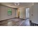 Bedroom with doors to closet and bathroom, featuring sleek flooring and abundant natural light at 2931 Randolph Ct, Conyers, GA 30012