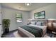 Comfortable bedroom with stylish decor, including plush bedding and modern light fixtures at 2931 Randolph Ct, Conyers, GA 30012