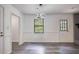 Dining area with modern lighting, neutral walls, and stylish flooring at 2931 Randolph Ct, Conyers, GA 30012