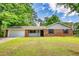Charming brick home with manicured lawn, attached garage, and inviting front porch at 2931 Randolph Ct, Conyers, GA 30012